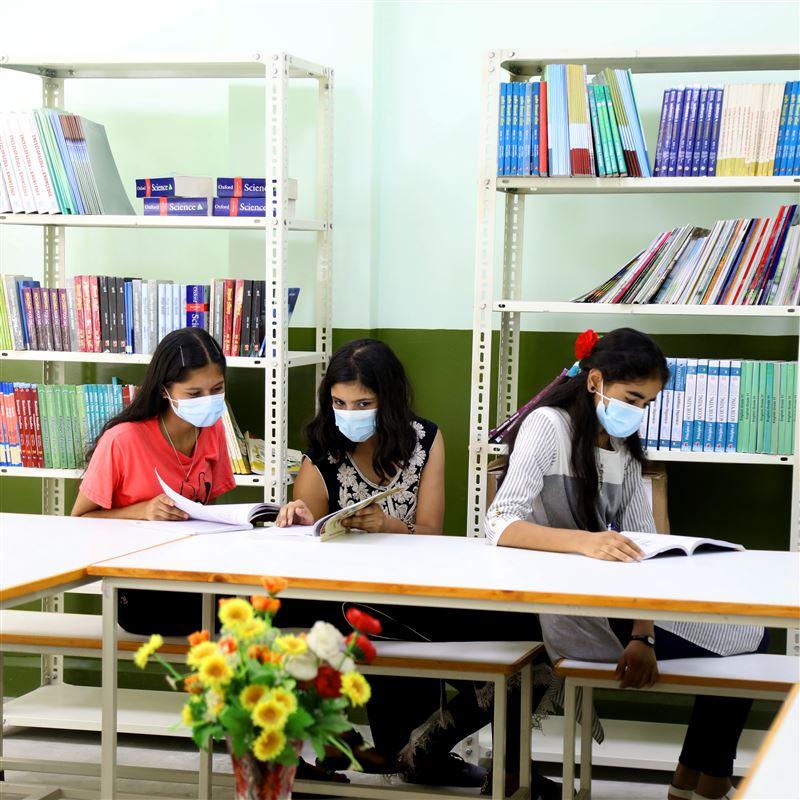 Students at the Adarsha Secondary School in Bhaktapur enjoy reading new books.